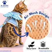 A brown spotted cat wearing a light blue pet harness with angel-wing shaped shoulder covers, shown on a pink background with marketing text and a circular inset showing the breathable mesh material.