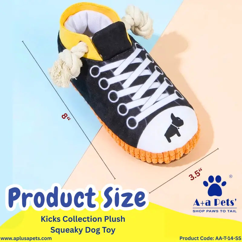 A plush dog toy shaped like a sneaker, shown with overlaid size measurements and branding text. The toy is mostly black with white laces and a white toe area, yellow collar lining, and an orange sole.