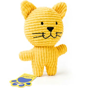 A yellow corduroy cat-shaped plush toy with black embroidered facial features, shown standing on a white background with a small yellow and blue tag attached near the base.