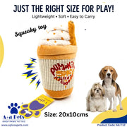 A plush dog toy shaped like a pumpkin spice latte cup, shown on a white promotional background with marketing text, a small paw-print tag, and two dogs beside it. The product is the toy itself; the dogs are included as contextual lifestyle elements in the listing image.