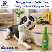 A black, white, and tan dog lies on a wooden floor in a living room, holding a plush bottle-shaped squeaky toy in its mouth. The toy is designed to look like a white Vodka bottle with a gray cap, and a green beer-bottle-shaped toy sits beside it.