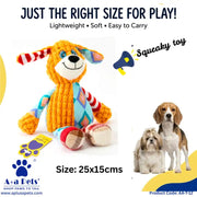 A colorful knitted dog squeaky toy with a striped red and white ear, blue and yellow striped tail, and multicolor body, shown on a white background with promotional text, a megaphone graphic, and two small dogs on the right. Branding for A+a Pets is visible.